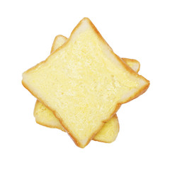 square bread with butter on white background, top view