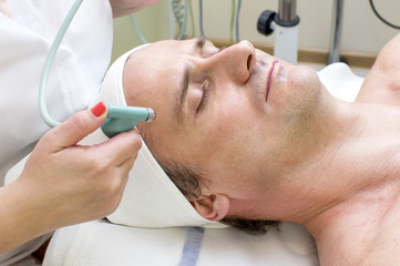 man in a beauty salon facial and massage