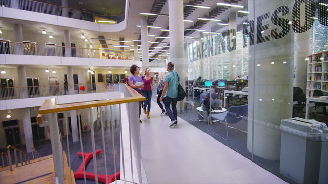 Diverse group of students in large modern university building