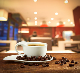 cup of coffee on blur cafe background