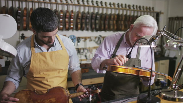 Father and son shopping together, make a purchase in a musical store