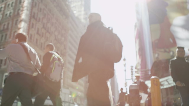 Crowds walking through a New York city street