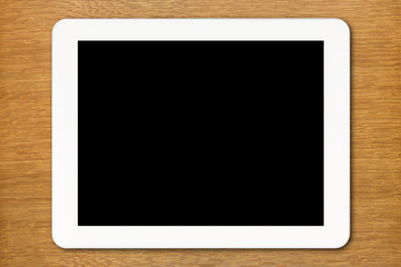 White Tablet PC with black screen on the table