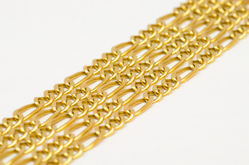 Fototapeta premium Gold necklaces arranged nicely in a row