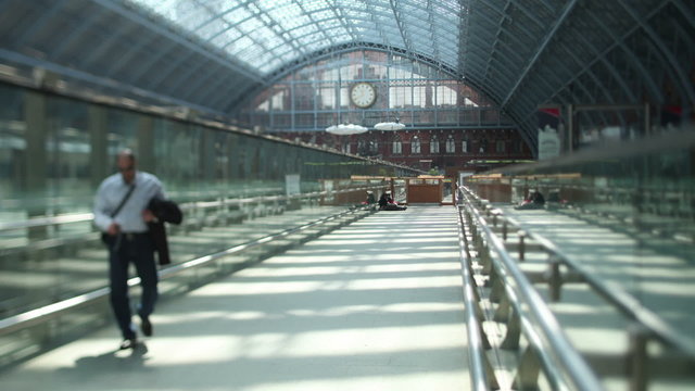 Time lapse of travelers and commuters passing through a London railway station