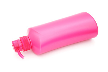 pink plastic pump cosmetic bottle on white background