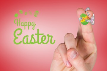 Composite image of fingers as easter bunny