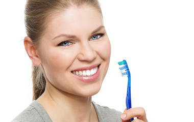 Young pretty girl with fresh white smile holding toothbrush