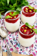 Homemade yogurt with raspberry and pistachio for breakfast