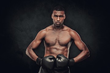 Obraz na płótnie Canvas Composite image of muscular boxer
