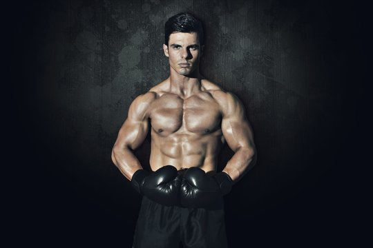 Composite image of muscular boxer