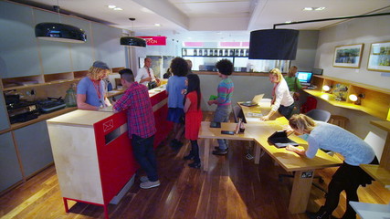 Time lapse of staff dealing with customers at business reception area