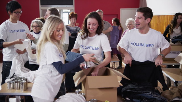 Charity volunteers sorting through donated goods