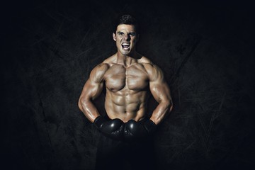 Fototapeta na wymiar Composite image of muscular boxer