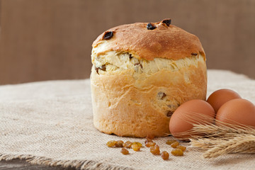 Backed traditional russian kulich easter cake with raisins