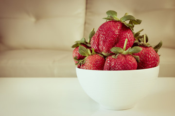 strawberries in a simple white bowl