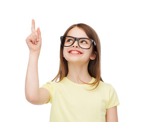 smiling cute little girl in black eyeglasses