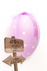 Composite image of easter egg hunt sign