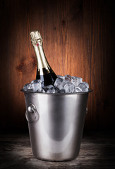 Champagne bottle in a bucket with ice