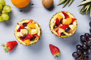 Fresh fruit salad served in bowls with fresh pineapple