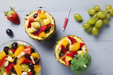 Fresh fruit salad served in bowls with fresh pineapple