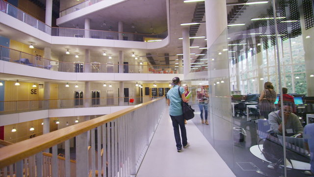 Diverse group of students in large modern university building