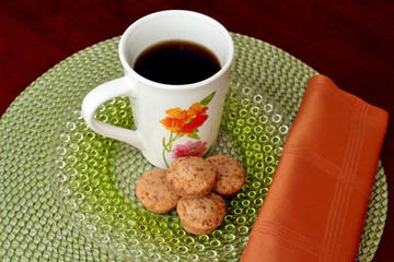 A cup of coffee and mini muffins