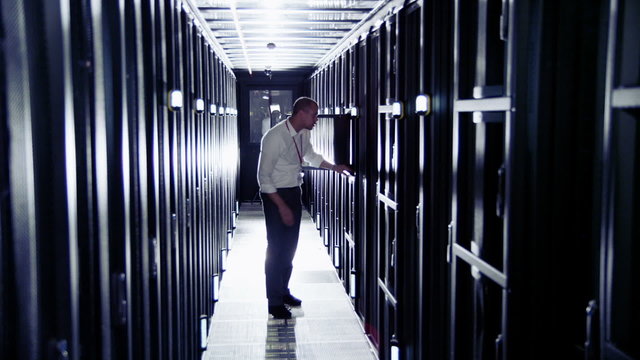 Attractive IT engineer working in a data center