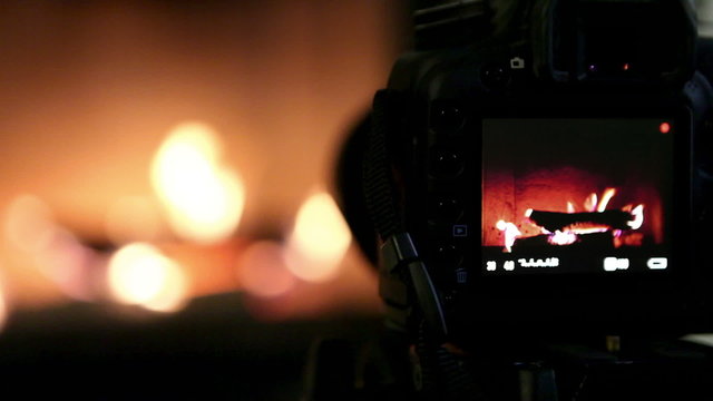 Cute home fireplace video shooting process with DSLR camera
