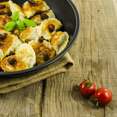 Fried dumplings on frying pan