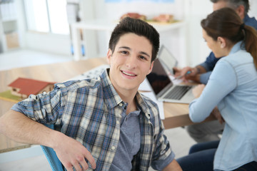 Portrait of college boy attending class