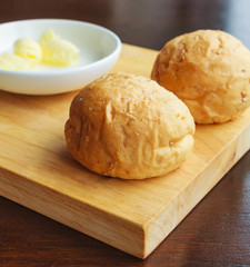 Bread with butter on a rustic cutting board