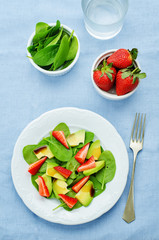 salad with spinach, avocado and strawberries