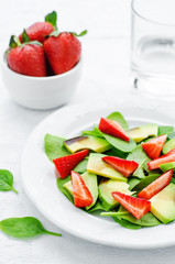 salad with spinach, avocado and strawberries