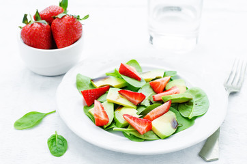 salad with spinach, avocado and strawberries