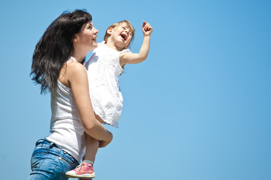 mother with her daughter in nature