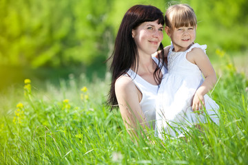 mother with her daughter in nature