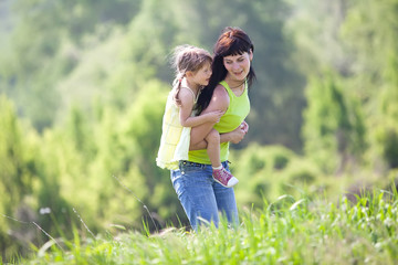 mother with her daughter in nature