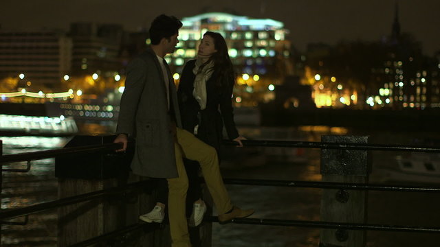 A man and woman spending time together in London at night