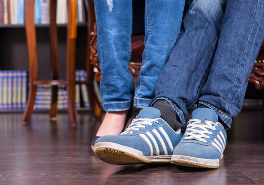 Legs and Feet of a Couple in Jeans and Shoes