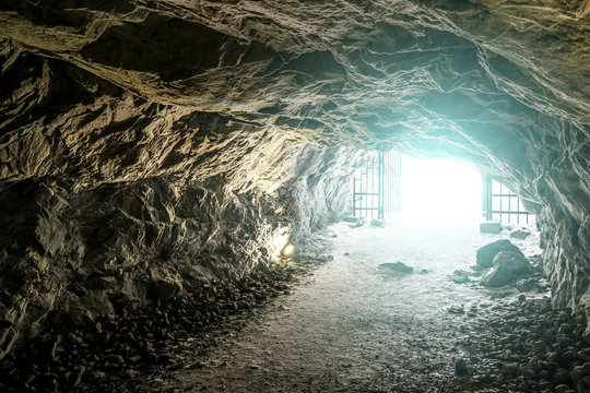 Bright light at the end of the caves in the Mountain Park of Rus