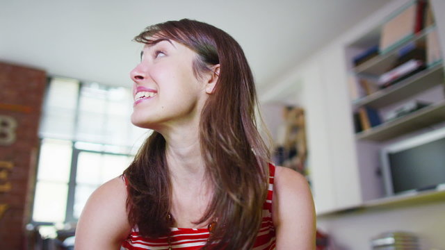 Happy attractive young woman having a video chat from computer screen's pov