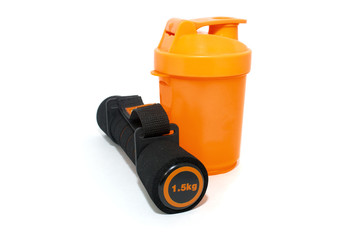 dumbbell and shaker isolated over white