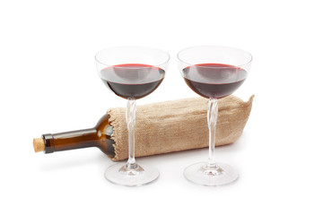 bottle of wine and glasses with red wine
