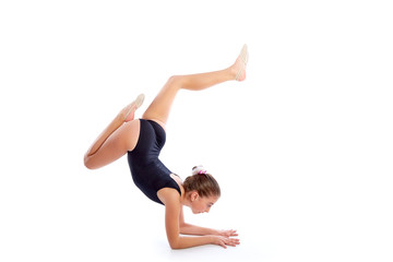 Kid girl rhythmic gymnastics exercises on white
