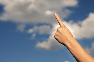 hand on a background sky