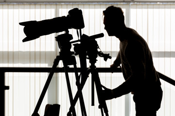 Silhouette of photographer and cameraman