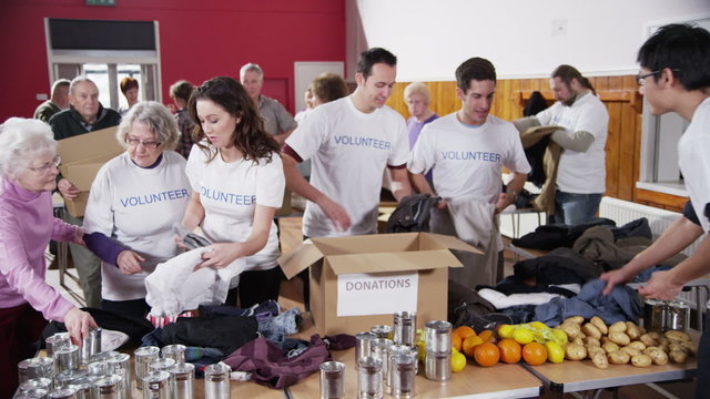Charity volunteers sorting through donated goods