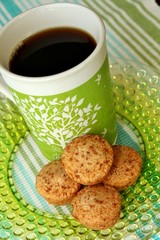 A cup of coffee and mini muffins