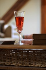 pink wine and old books on the table